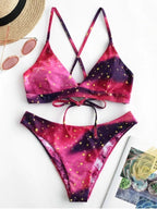 Mivora galaxy print bikini set featuring vibrant pink and purple colors with star accents, perfect for summer beach vibes.