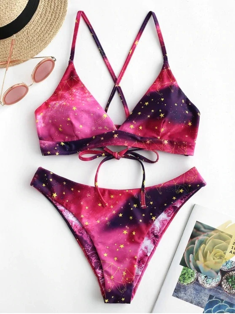Mivora galaxy print bikini set featuring vibrant pink and purple colors with star accents, perfect for summer beach vibes.