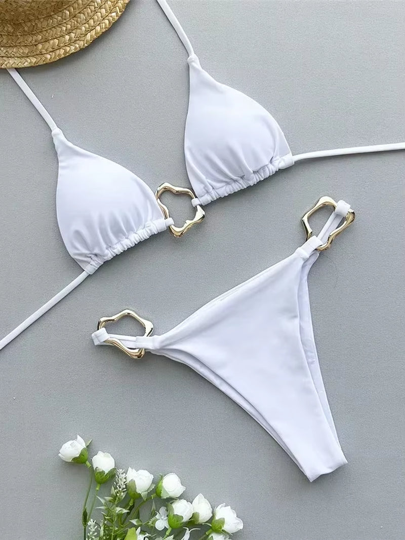 Sleek white triangle bikini set with gold accents, perfect for summer swimwear styles.